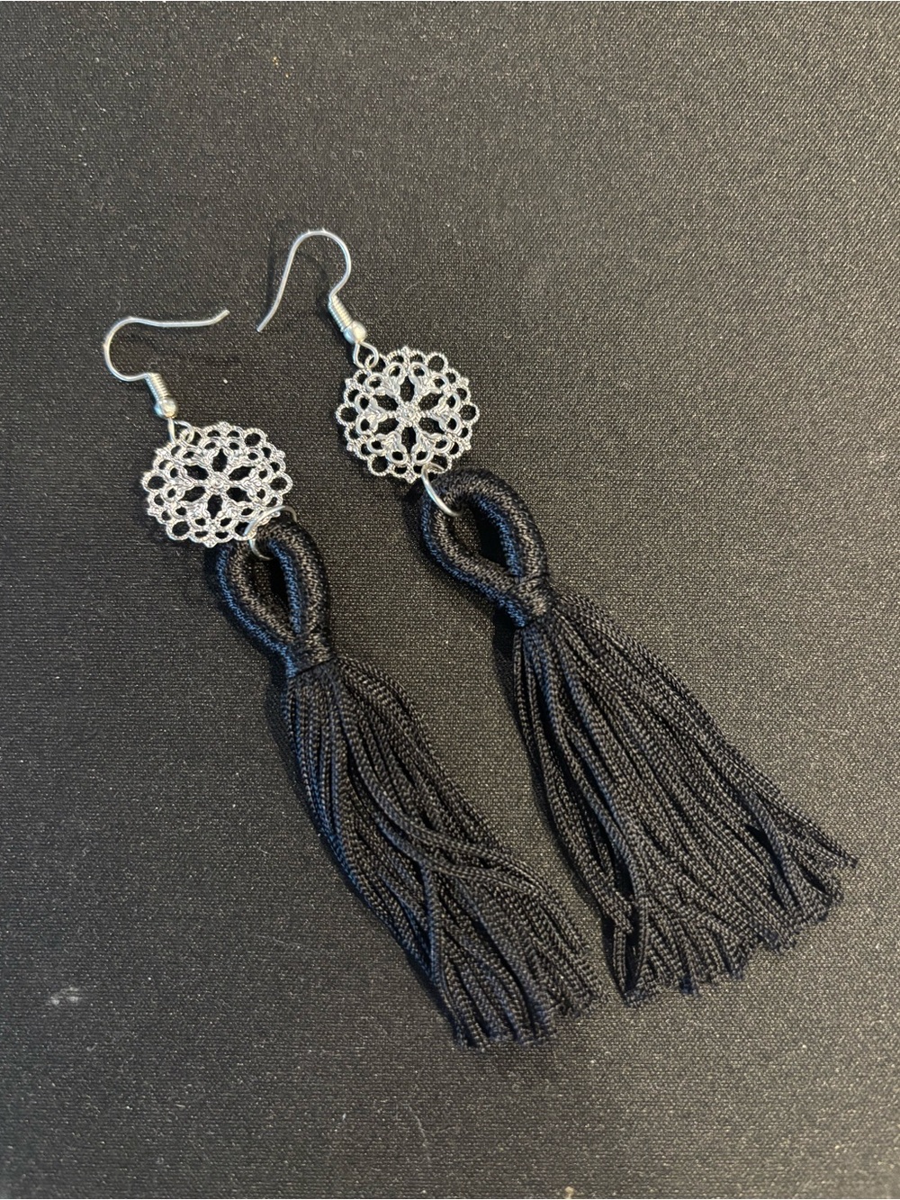 Long tassel earrings with filigree design